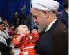 کودکی در آغوش دکتر روحانی (عکس)
