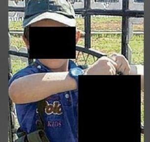 سر بریده در دست کودک داعشی /عكس