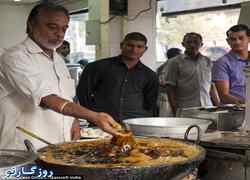مردی که با دست ماهی سرخ شده را از روغن داغ بیرون می آورد!+تصاویر